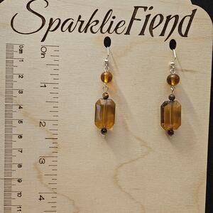Brown faceted and round acrylic beaded dangle earrings